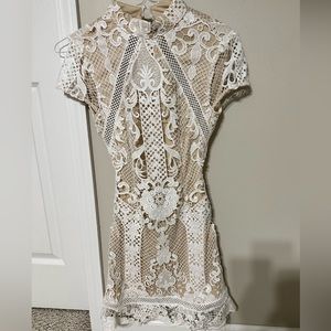 Opened back white mini dress bought from Revolve. Worn once! XS